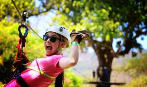 An ISL volunteer enjoying a zip line.